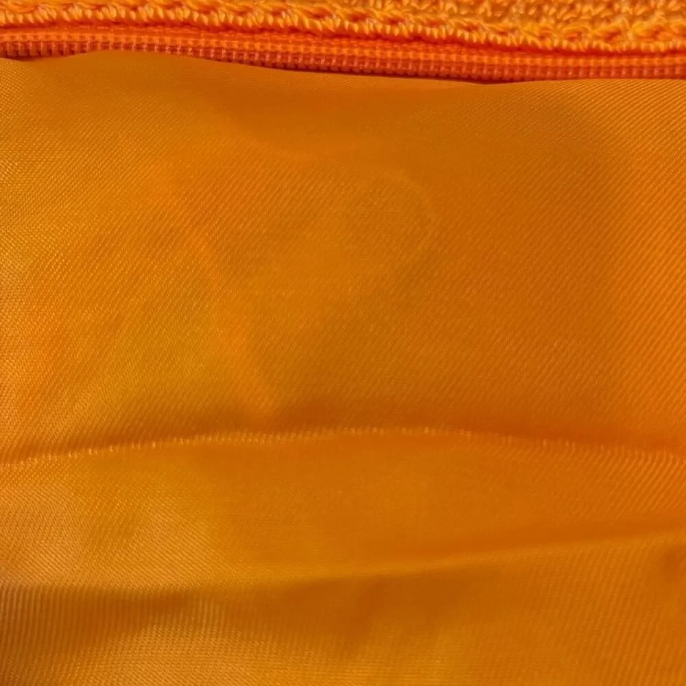 The Sak Crochet Orange Cosmetic Pouch Bag